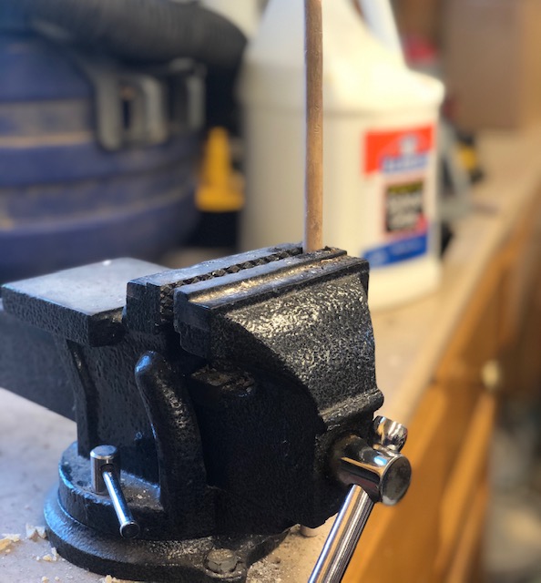 Vise used to secure dowel rod