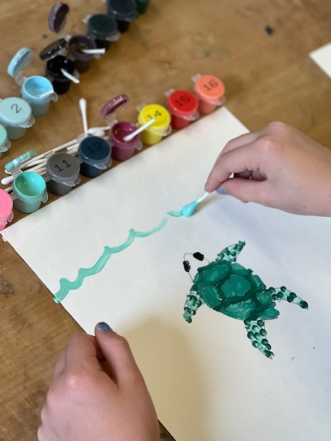 Pincer grasp exercise for kids: Using a cut Q-tip for dot art to encourage a functional tripod pencil grasp.