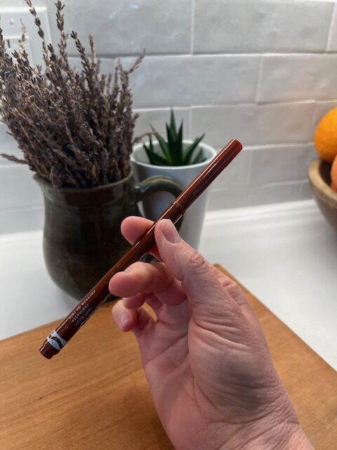 In-hand manipulation task: Complex rotation exercise flipping a pen to develop mature fine motor control.