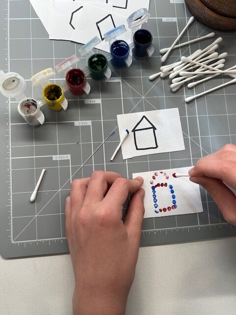 Q-tip painting activity to develop visual discrimination and fine motor coordination in children.