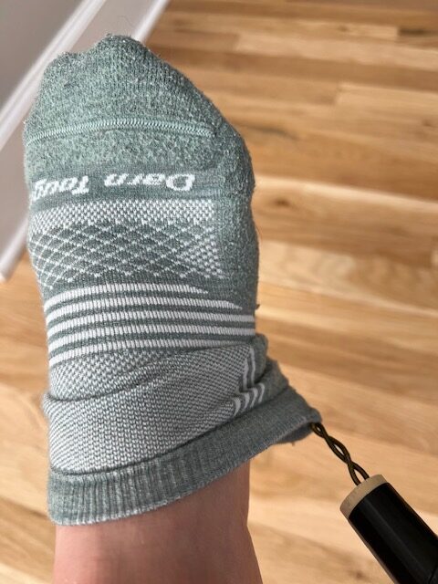 DIY dressing stick used to remove socks