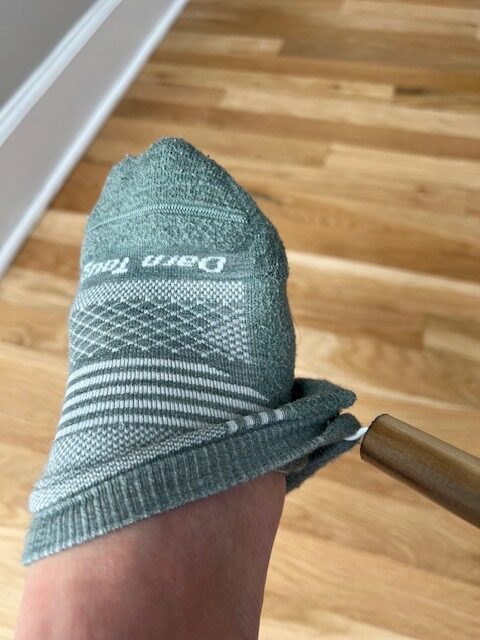 DIY dressing stick used to remove socks