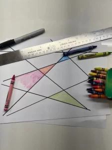 Bilateral integration exercise: Using a ruler and marker to develop asymmetrical bilateral coordination hand roles and spatial awareness.
