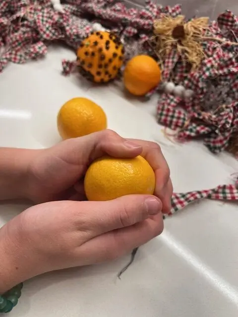 clove and orange pomanders a fine motor project