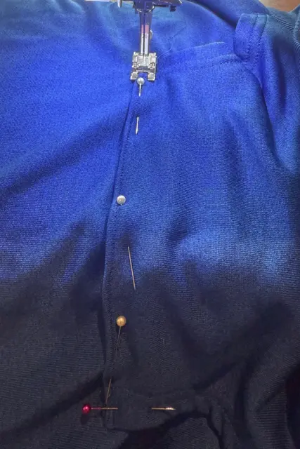 DIY sensory fidget hoodie, step #4 in step-by-step tutorial (sew kangaroo pocket back in place).