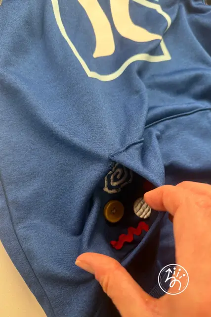 Finished DIY sensory fidget hoodie providing discreet tactile input for sensory processing needs.