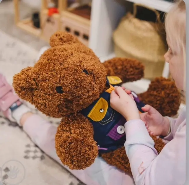 weighted stuffed animal with dressing vest